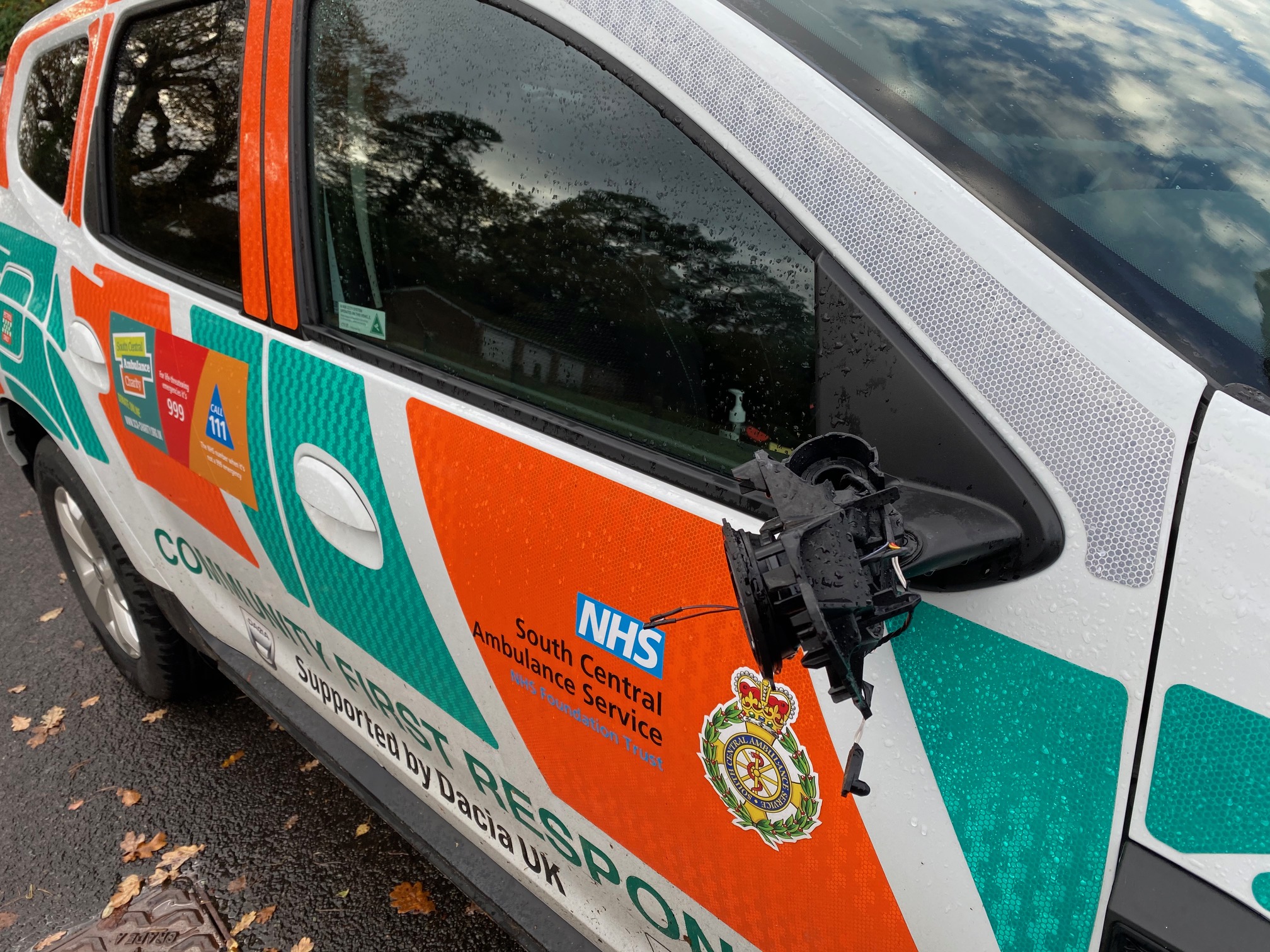 Responder car with damaged wing mirror