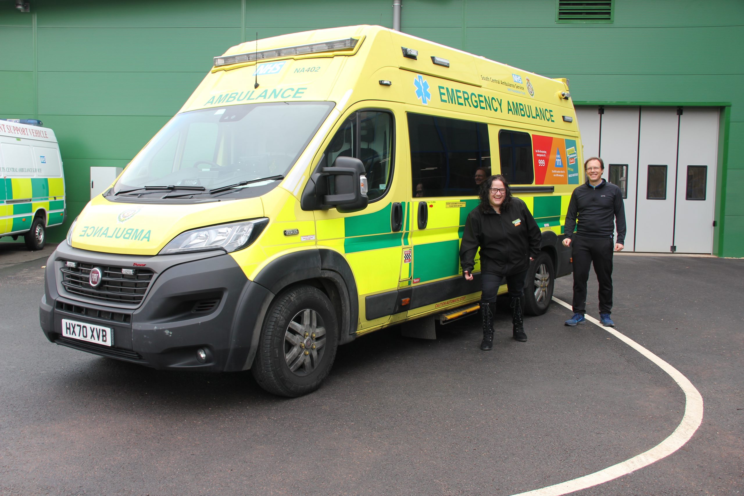 Laura and Will standing next to an ambulance