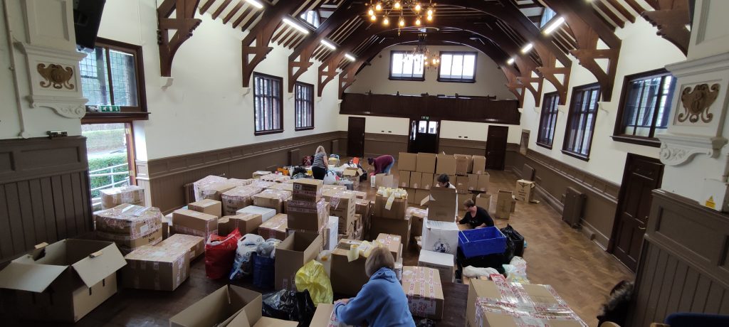 Volunteers sort boxes of donations at Waddesdon Hall, Buckinghamshire