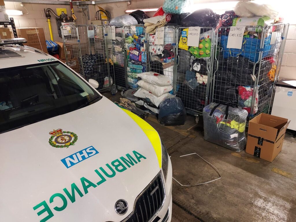 Donated goods in trolleys in ambulance station