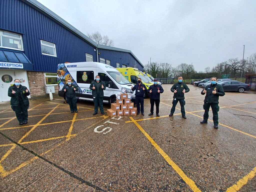 People standing in front of ambulances