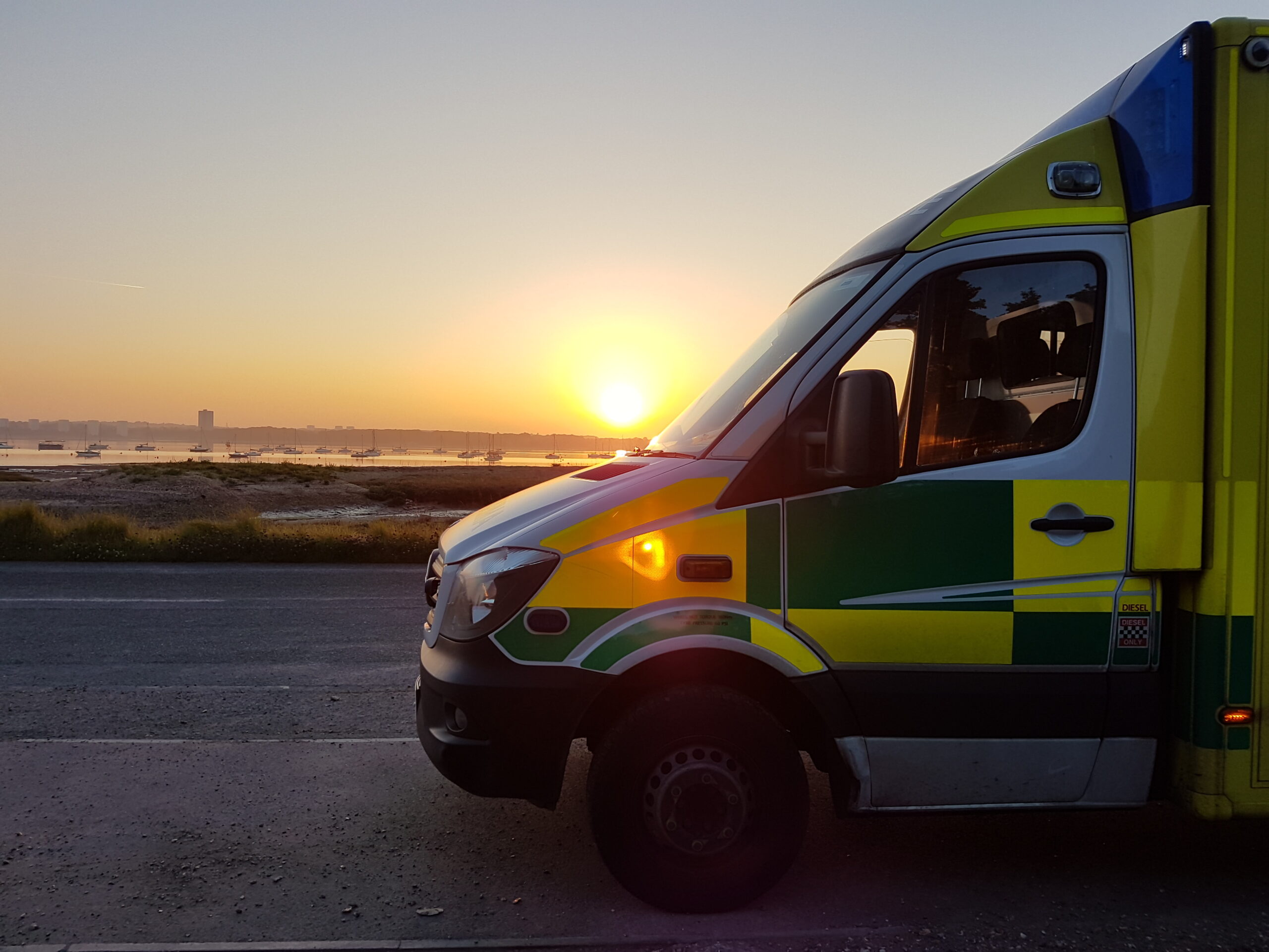 SCAS ambulance with sunset