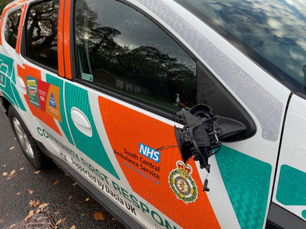 Responder car with damaged wing mirror