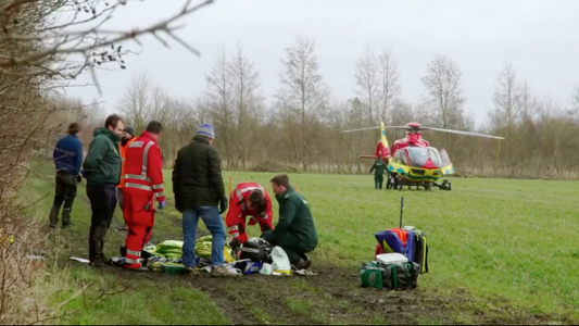 Ambulance crew members treat Philippa