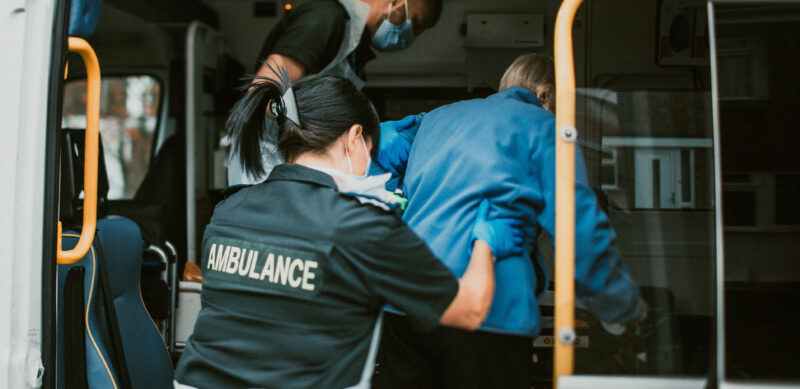 PTS staff helping a patient