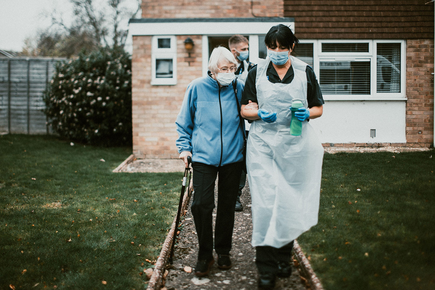 PTS staff helping a patient