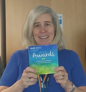 Staff Member with Award