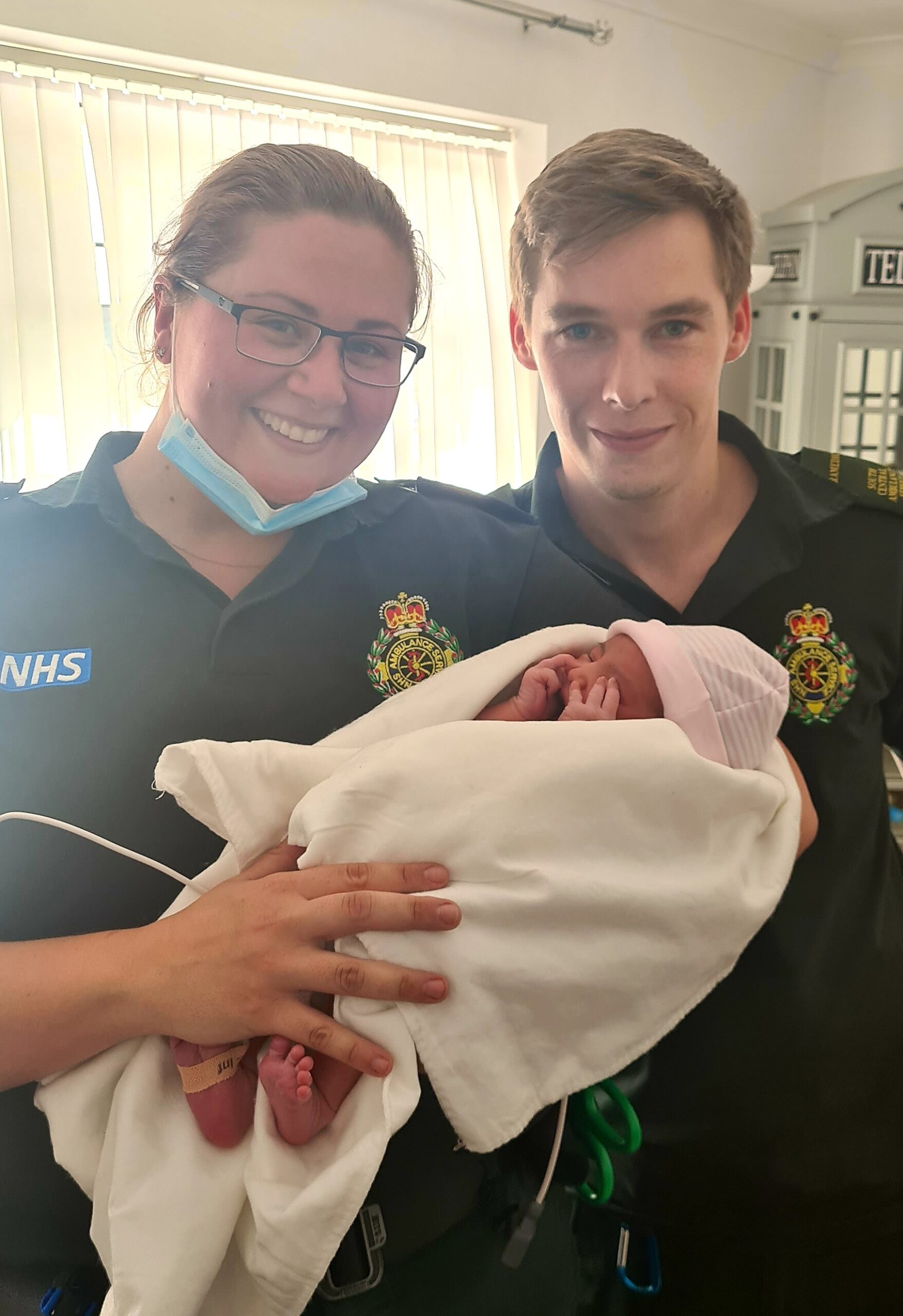 SCAS crew holding a new-born baby