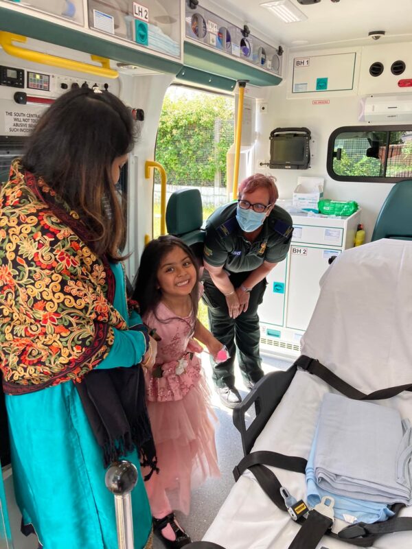 Inside the Ambulance Image of SCAS colleague and public inside the ambulance