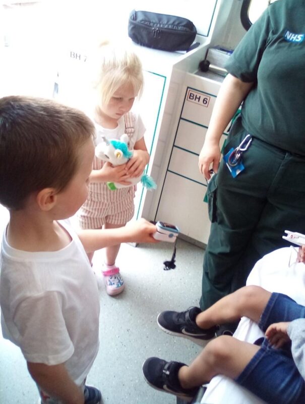 SCAS crew teaching children inside an ambulance