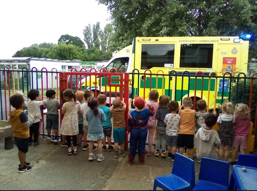 School children view the ambulance vehicle