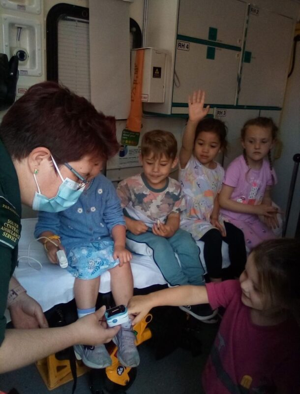 SCAS crew teaching children inside an ambulance