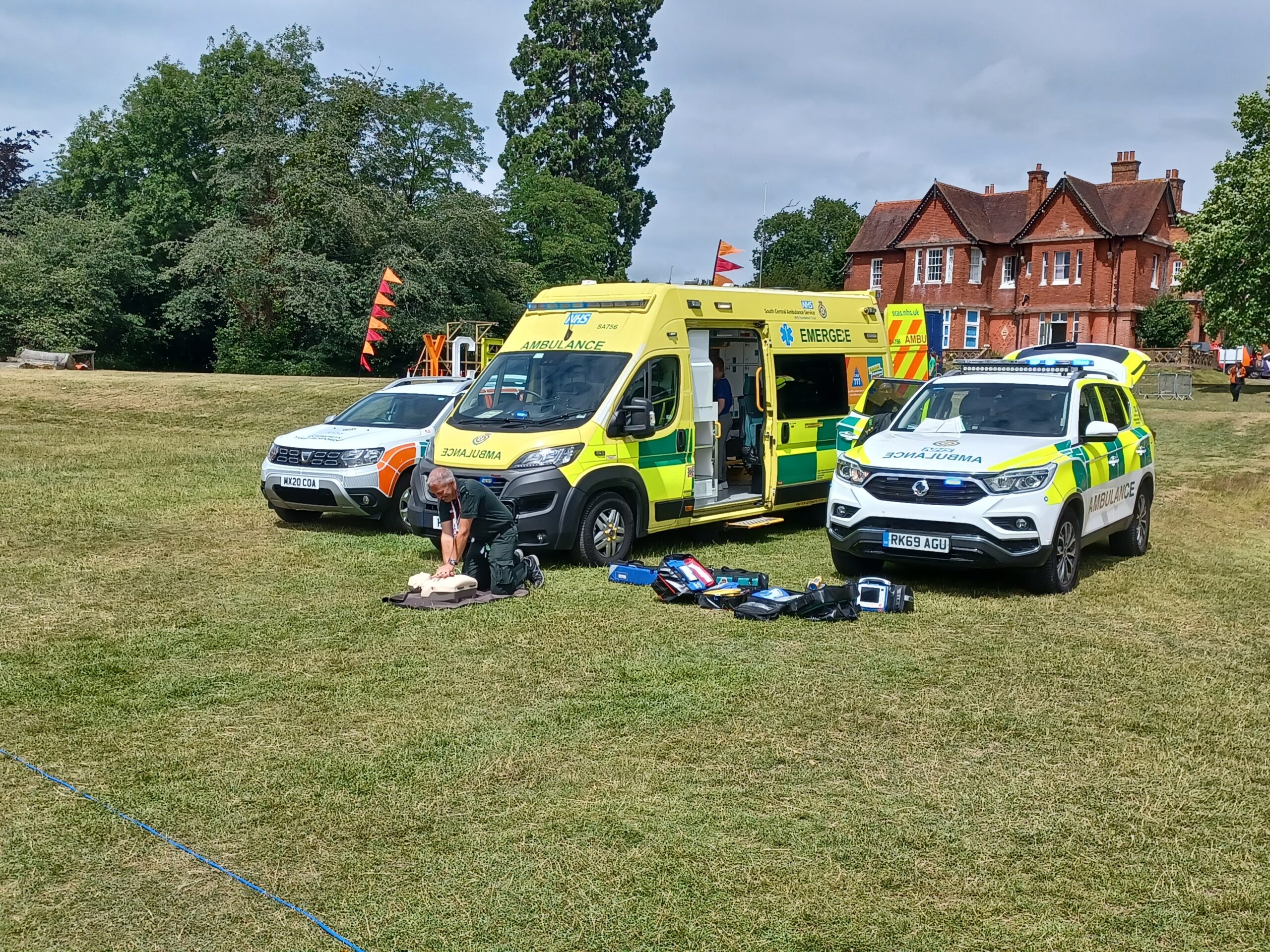 SCAS vehicles in open field at the festival
