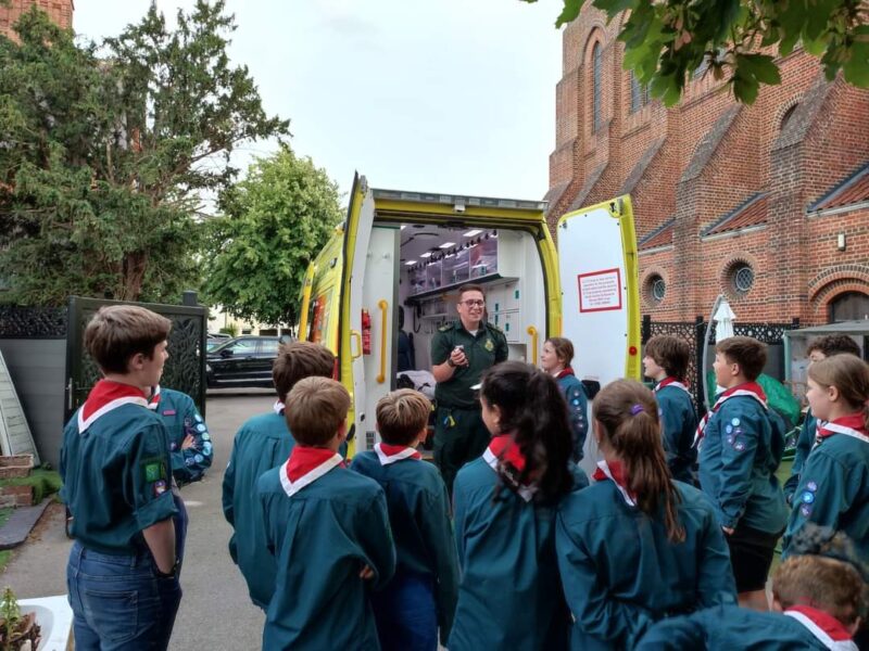 Scout and Cub group looking inside an ambulance vehicle