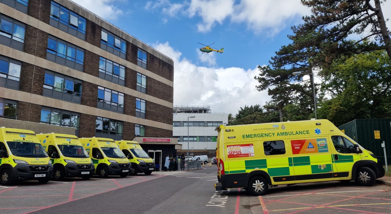 Ambulances parked outside a hospital emergency department