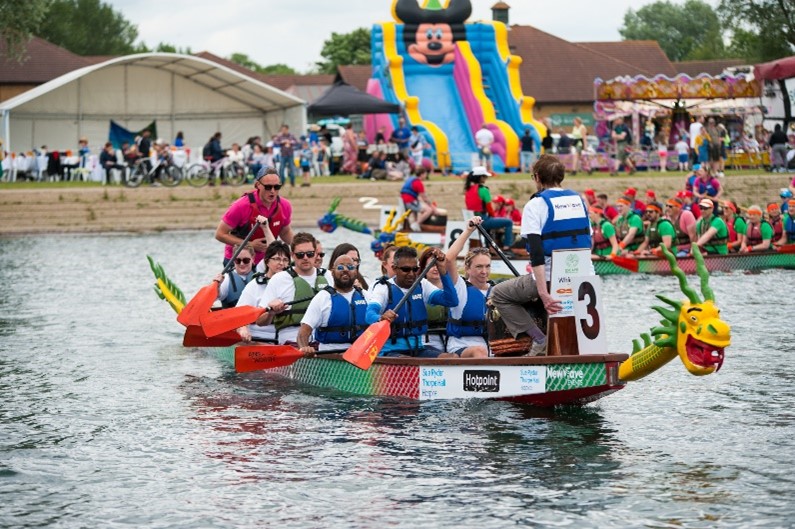 Dragon boat with crew of ten in the water