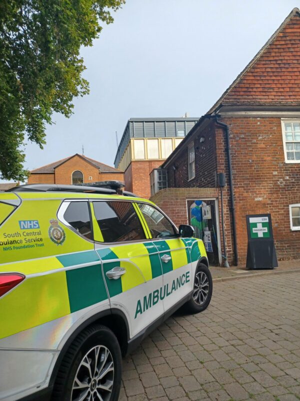 Emergency ambulance response car parked outside a building