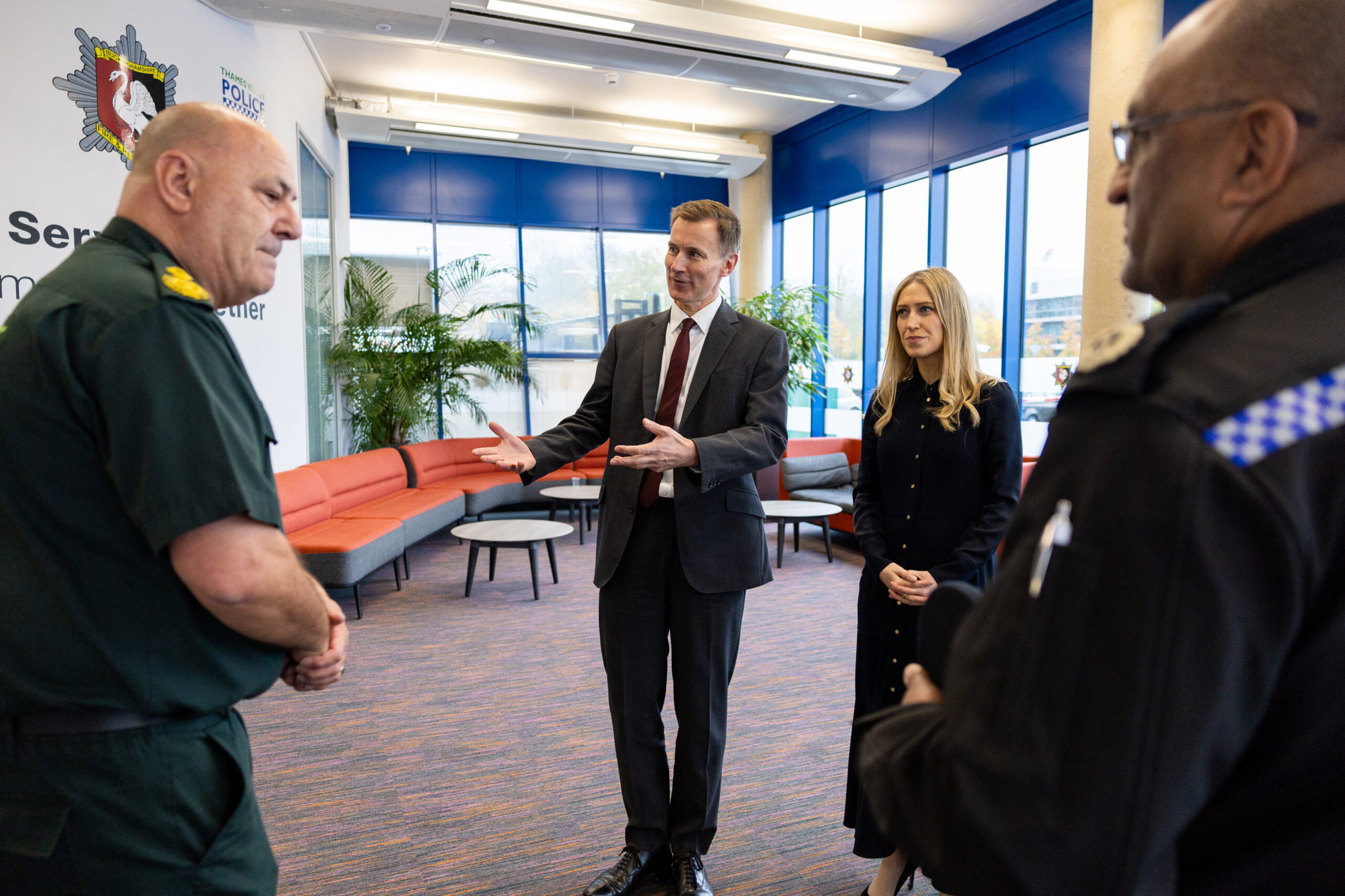 Chancellor Jeremy Hunt and Chief Secretary Laura Trott are greeted on arrival at the Blue Light Hub