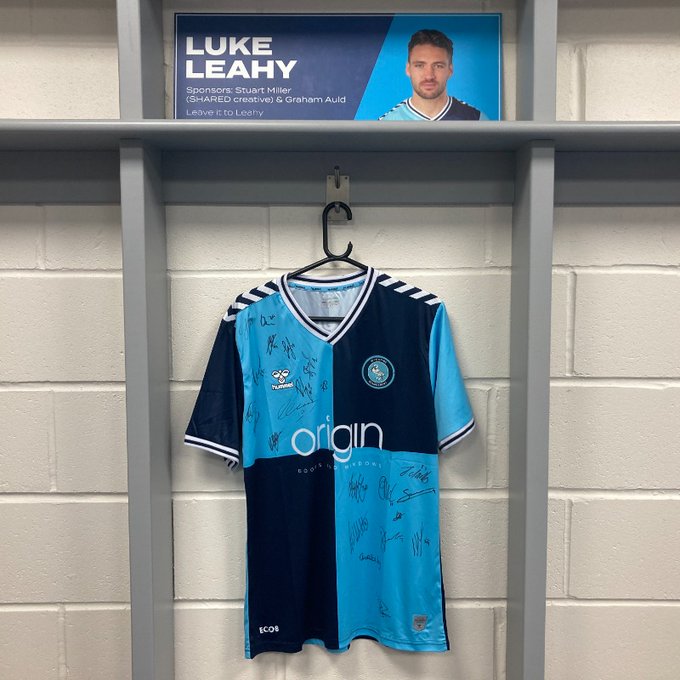 A Wycombe Wanderers Football Shirt hanging in the changing room