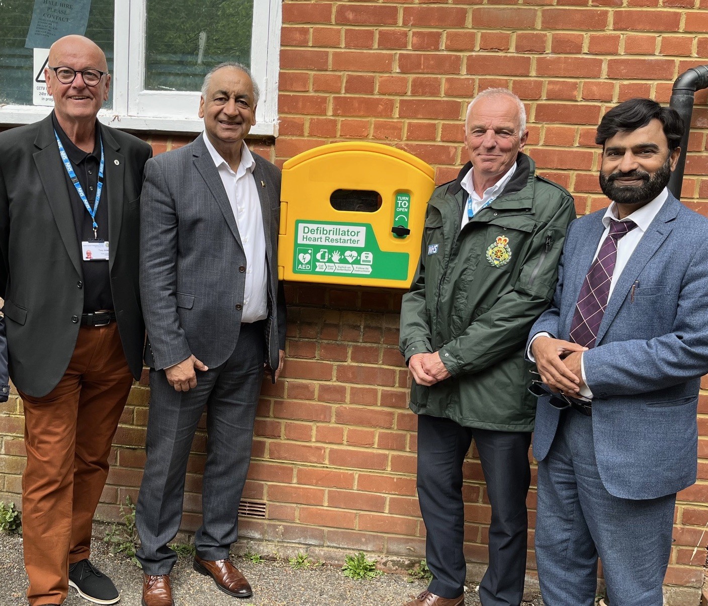 The new AED installed on the wall