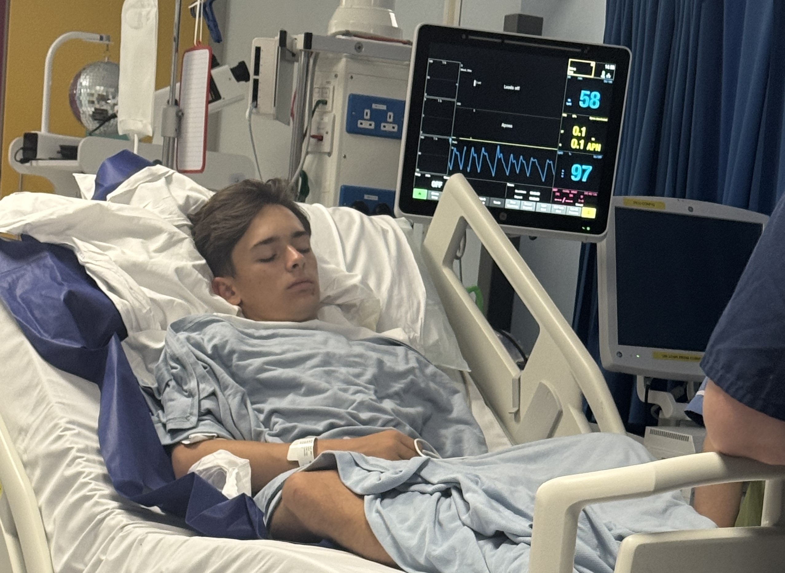 A 15-year-old boy in a hospital bed